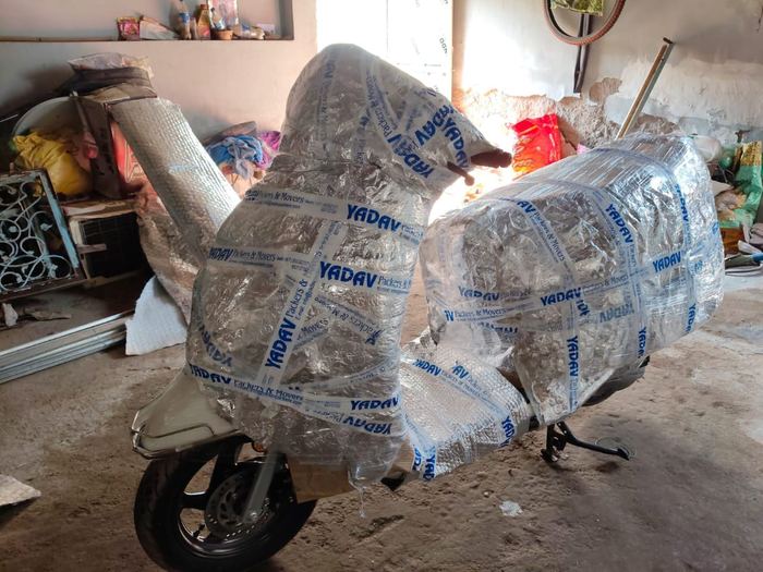 Two-wheeler wrapped for safe transit by packers and movers in Jaipur