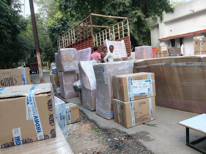 Vedanta Cargo and Movers crew loading cartons onto the truck